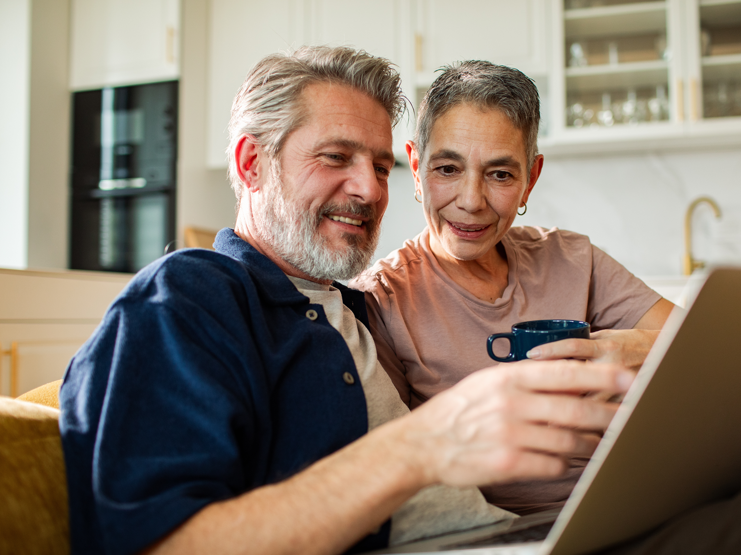 Two people look at laptop together to understand some words used in legal expenses insurance