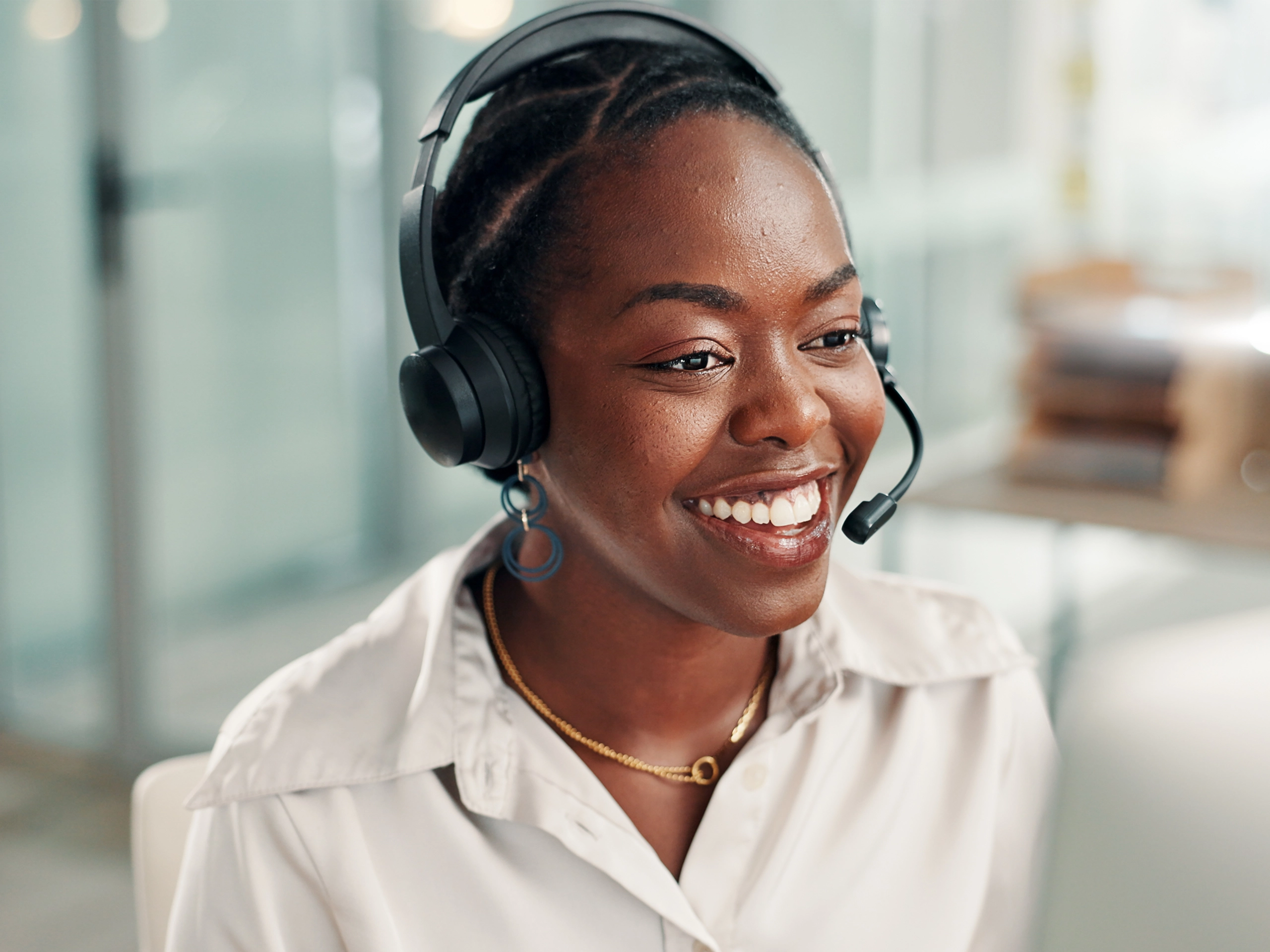 Women with a headset on looking happy