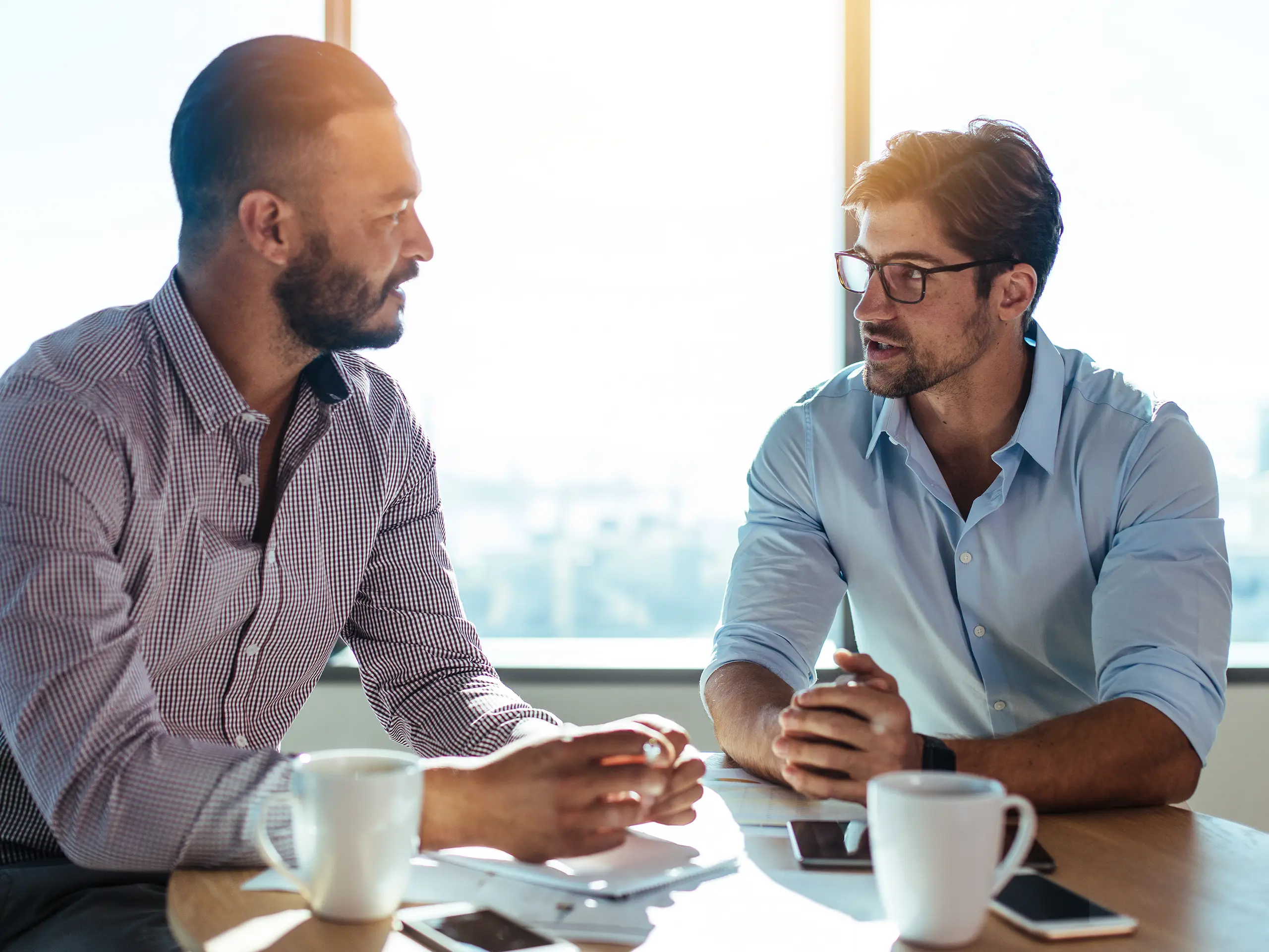 Two men at work talking to eachother