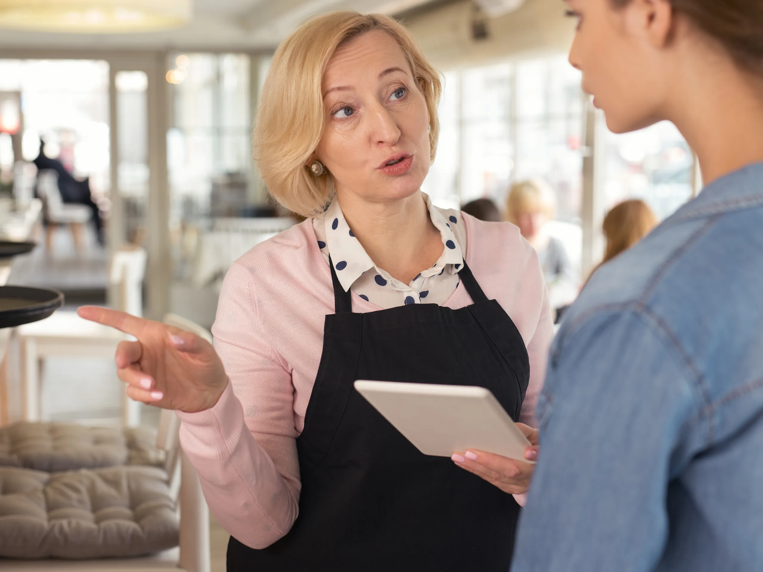 Female employer talking to her staff member