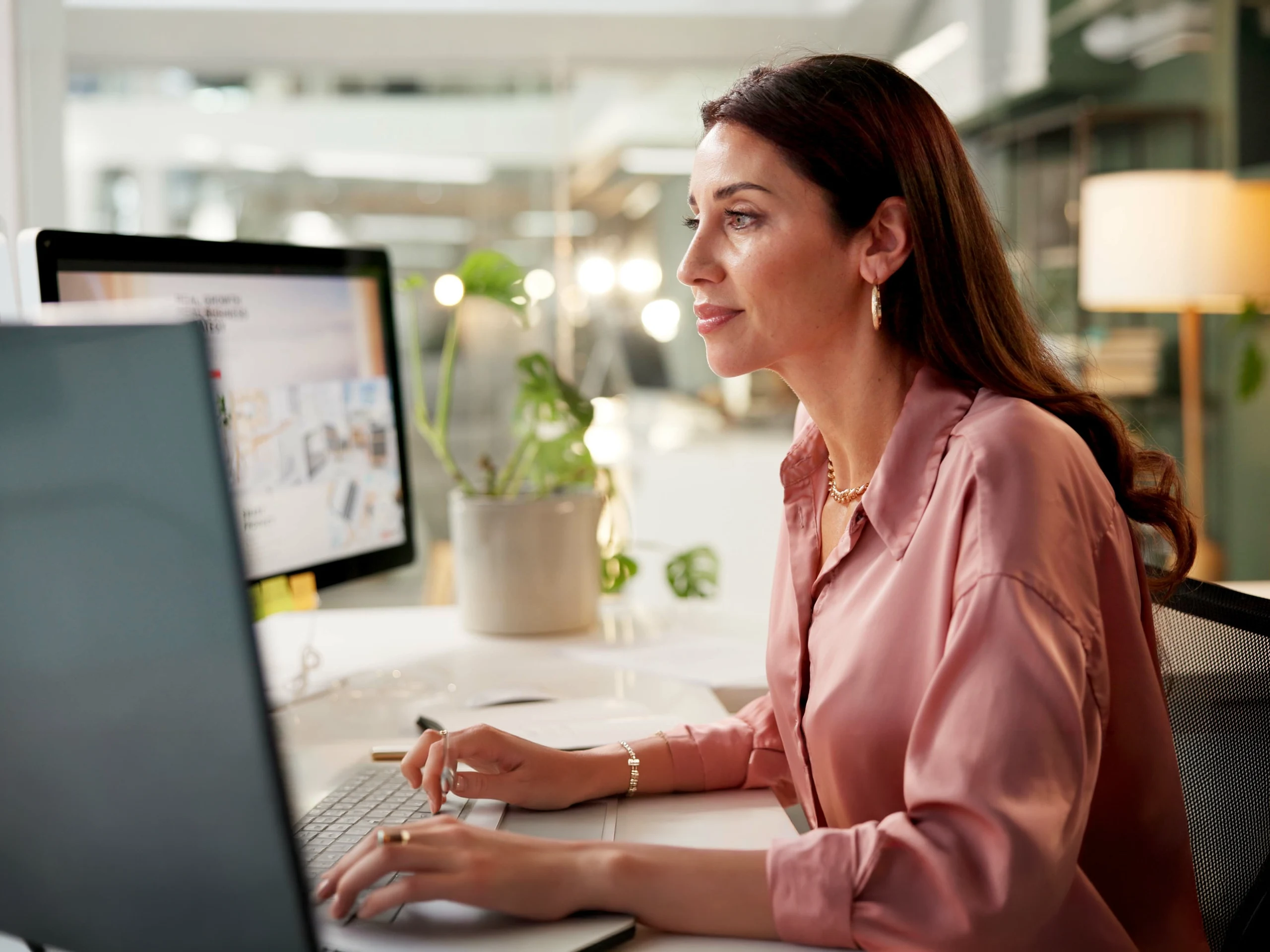 Woman, reading and computer screen in office for business