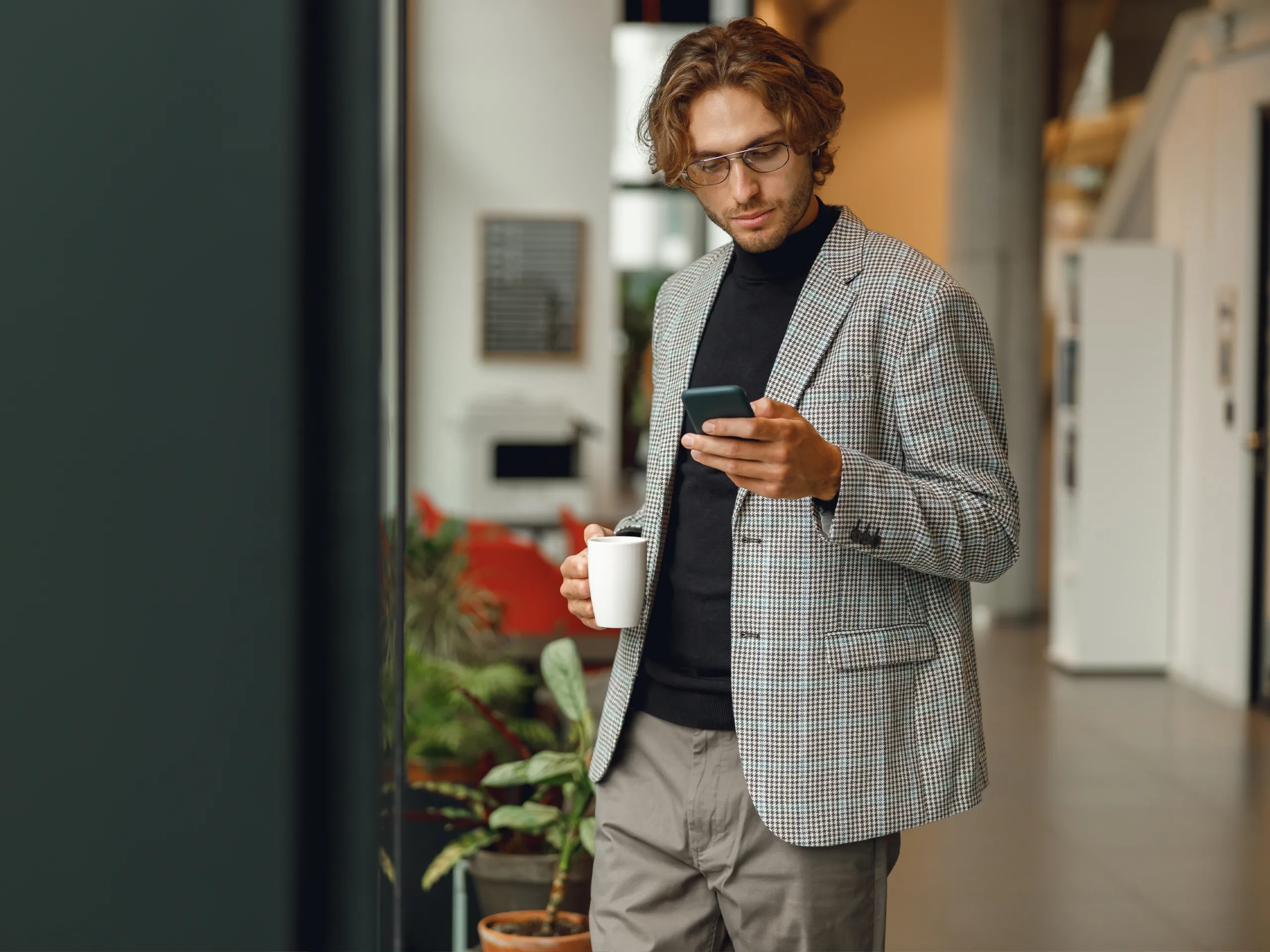 Office Manager holding a mobile phone