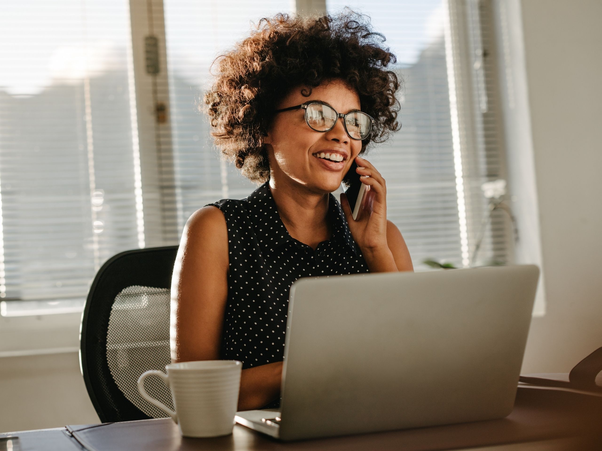 businesswoman talking at the phone, office, desk