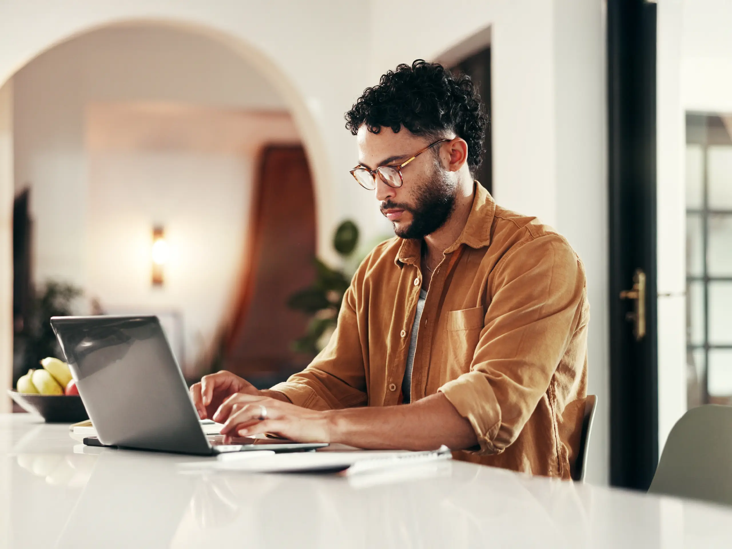 Laptop, typing or serious man in home office for freelance, online research