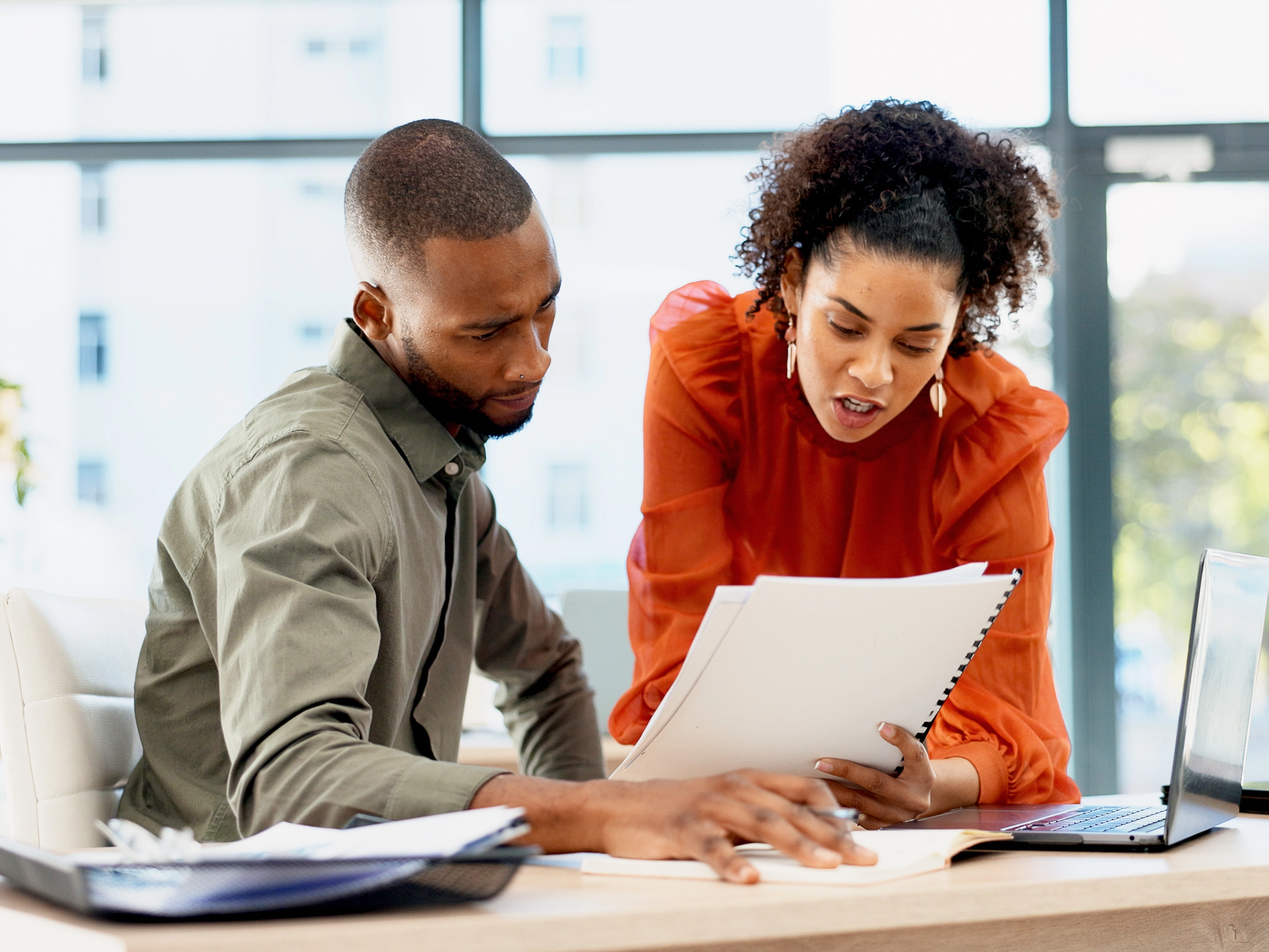 Document, business and people in office with advice, planning or review of resume for hiring. Application, portfolio and human resources team with paper for question, decision or career assessment