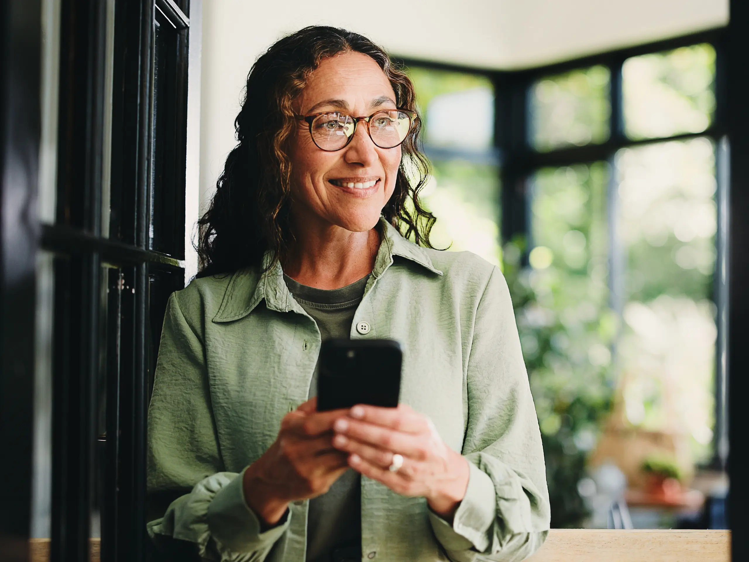 Woman smiling after receiving a good news