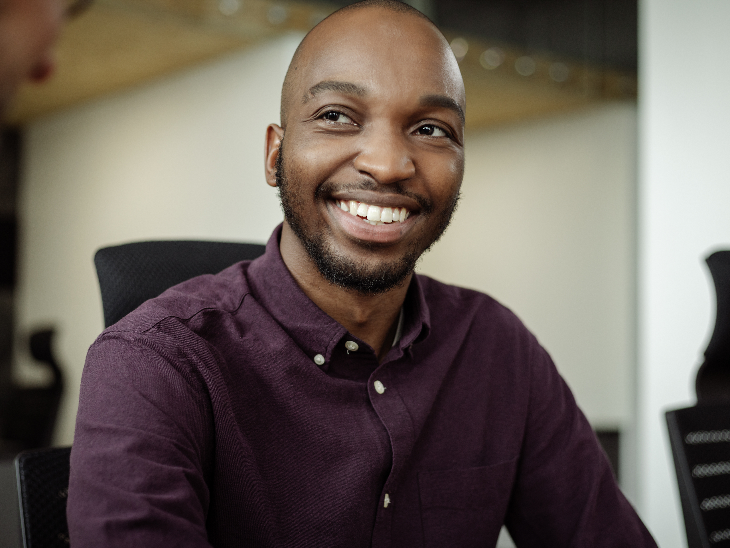 Man in office smiling