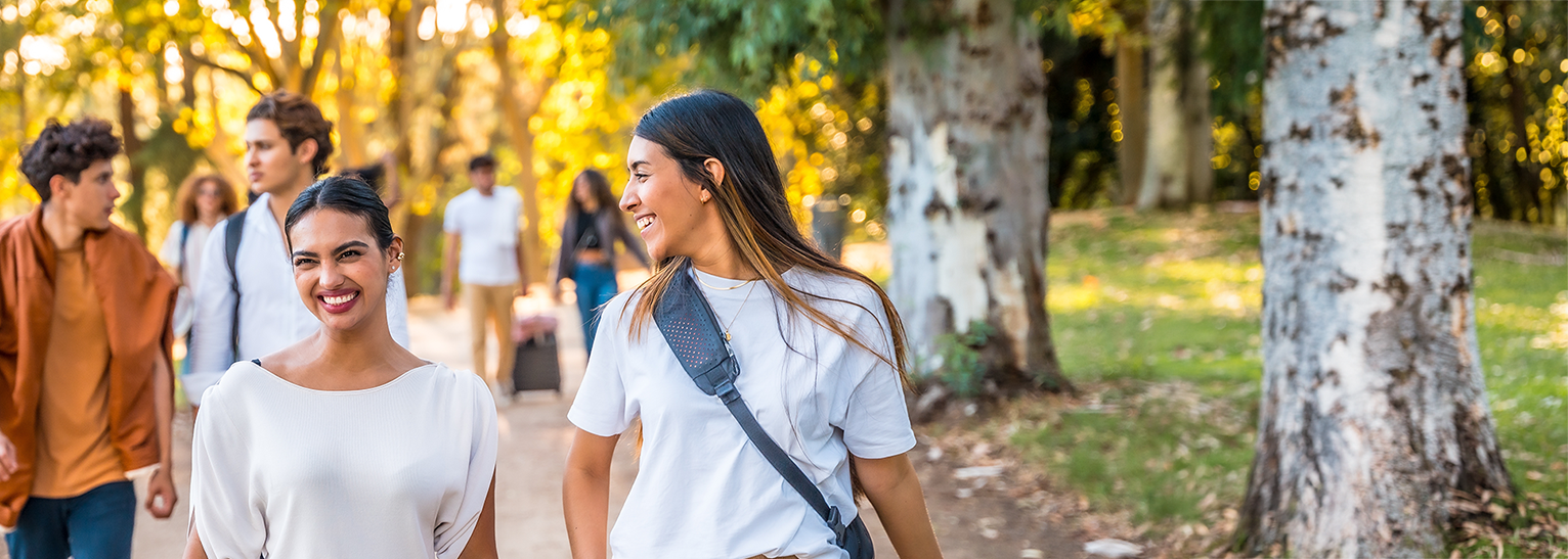 Women walking through park