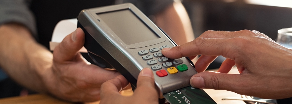 A person using a card machine