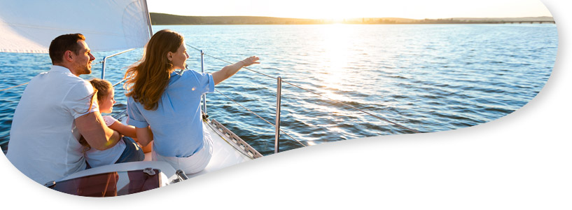 A family looking out to sea on a boat